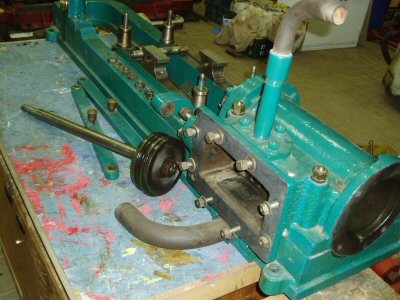 The engine stripped down, showing piston and piston rod etc.